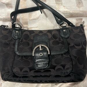 Coach purse. Black with front pocket. The strap  is removable.